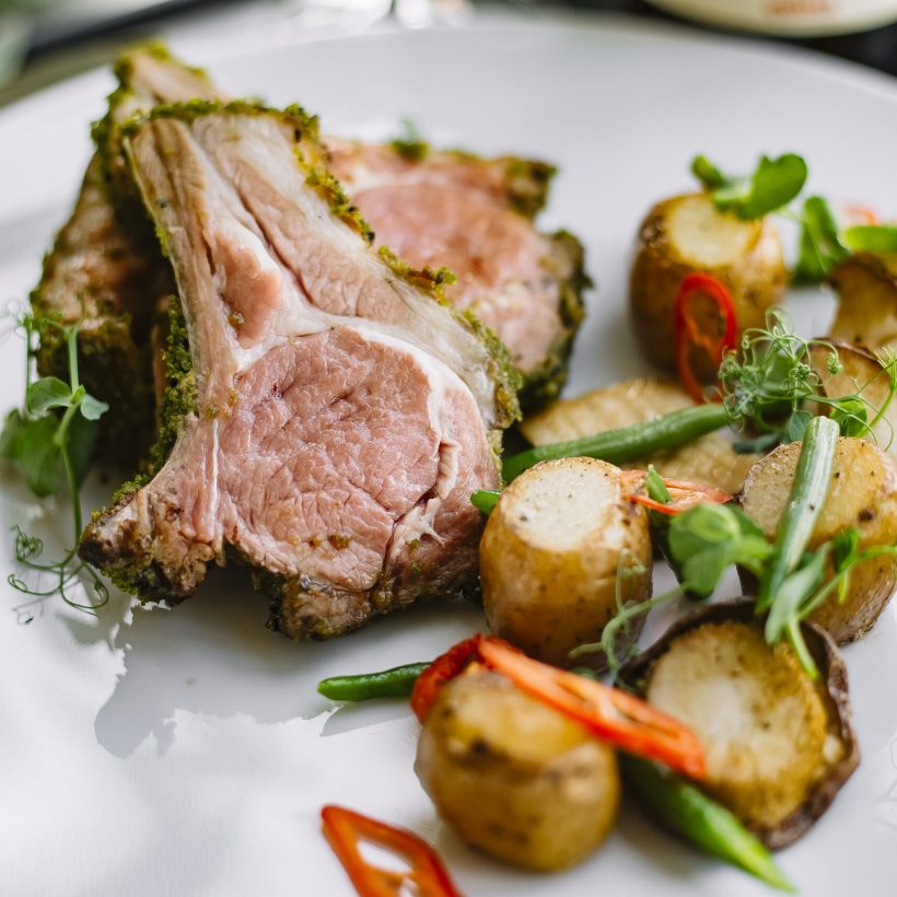 front view fried ribs with potatoes and herbs